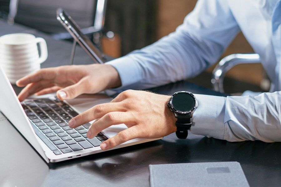 man writing an ATS friendly CV